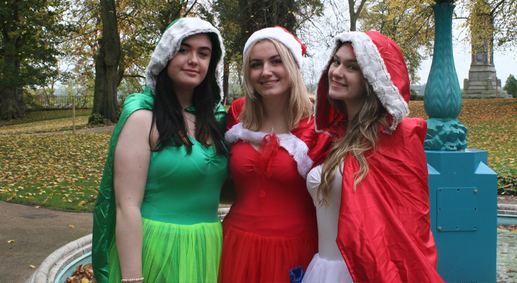 SERC Performing Arts students Beth McMeekin, Mollie Russel and Niamh McGuigan. dressed as festive elves.